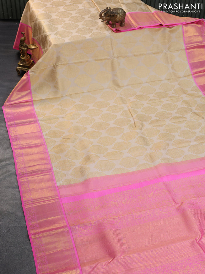 Pure kanchipuram silk saree cream and candy pink with allover zari woven brocade weaves and rich zari woven border