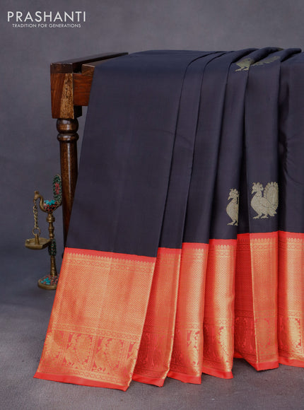 Pure kanchipuram silk saree black and orange with annam zari woven buttas and long zari woven korvai border