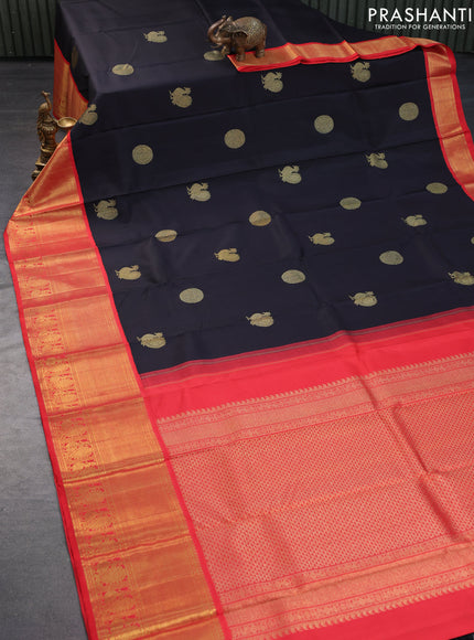 Pure kanchipuram silk saree black and orange with annam zari woven buttas and long zari woven korvai border