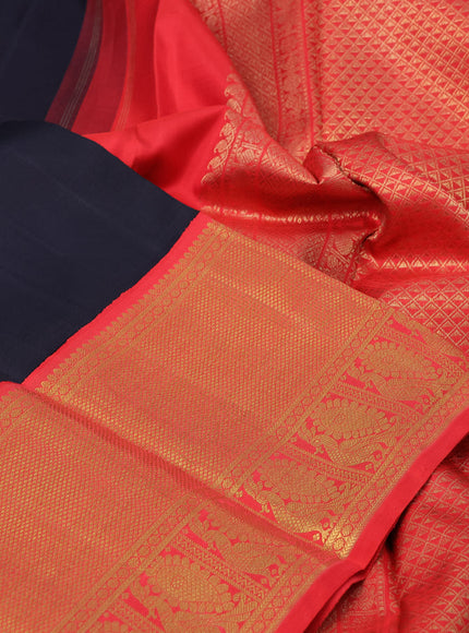 Pure kanchipuram silk saree black and orange with annam zari woven buttas and long zari woven korvai border