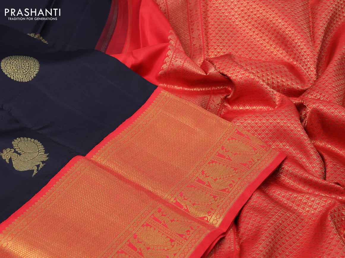 Pure kanchipuram silk saree black and orange with annam zari woven buttas and long zari woven korvai border