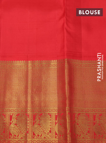 Pure kanchipuram silk saree black and orange with annam zari woven buttas and long zari woven korvai border