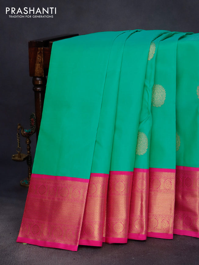 Pure kanchipuram silk saree teal green shade and pink with zari woven buttas and long zari woven korvai border