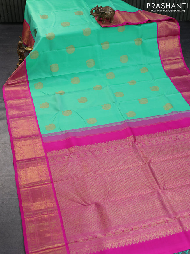 Pure kanchipuram silk saree teal green shade and pink with zari woven buttas and long zari woven korvai border