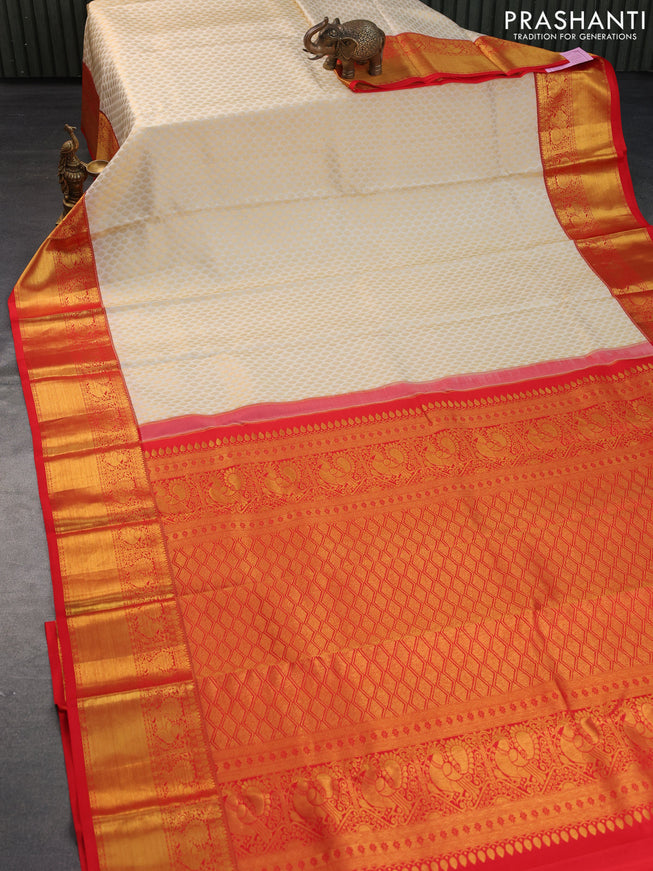 Pure kanchipuram silk saree cream and red with allover zari woven butta weaves and rich annam zari woven border