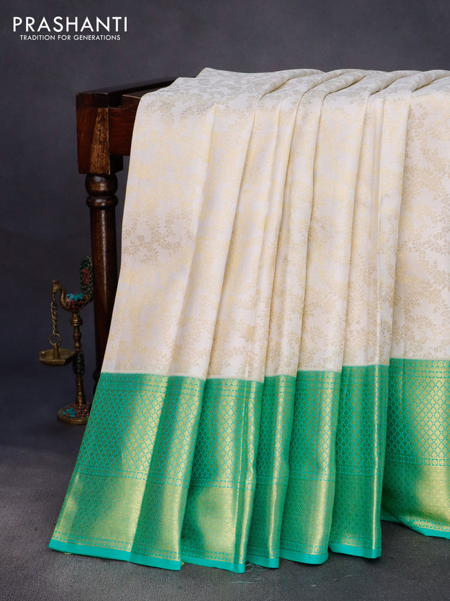 Pure kanchipuram silk saree off white and green with allover zari woven brocade weaves and long zari woven border