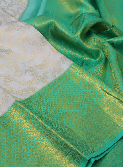 Pure kanchipuram silk saree off white and green with allover zari woven brocade weaves and long zari woven border