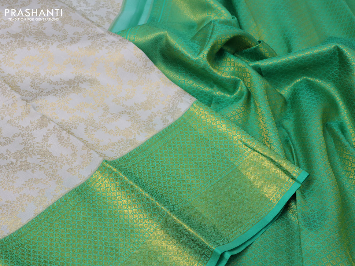 Pure kanchipuram silk saree off white and green with allover zari woven brocade weaves and long zari woven border