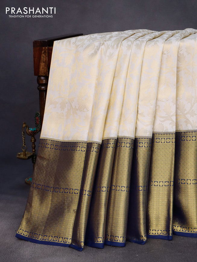 Pure kanchipuram silk saree off white and navy blue with allover zari woven brocade weaves and long rich zari woven border