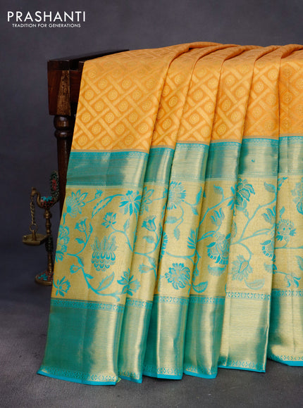 Pure kanchipuram silk saree mustard yellow and teal blue with allover zari woven brocade weaves and long zari woven border