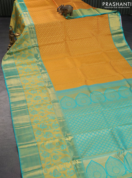 Pure kanchipuram silk saree mustard yellow and teal blue with allover zari woven brocade weaves and long zari woven border