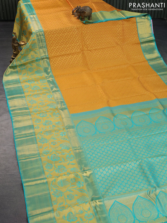 Pure kanchipuram silk saree mustard yellow and teal blue with allover zari woven brocade weaves and long zari woven border