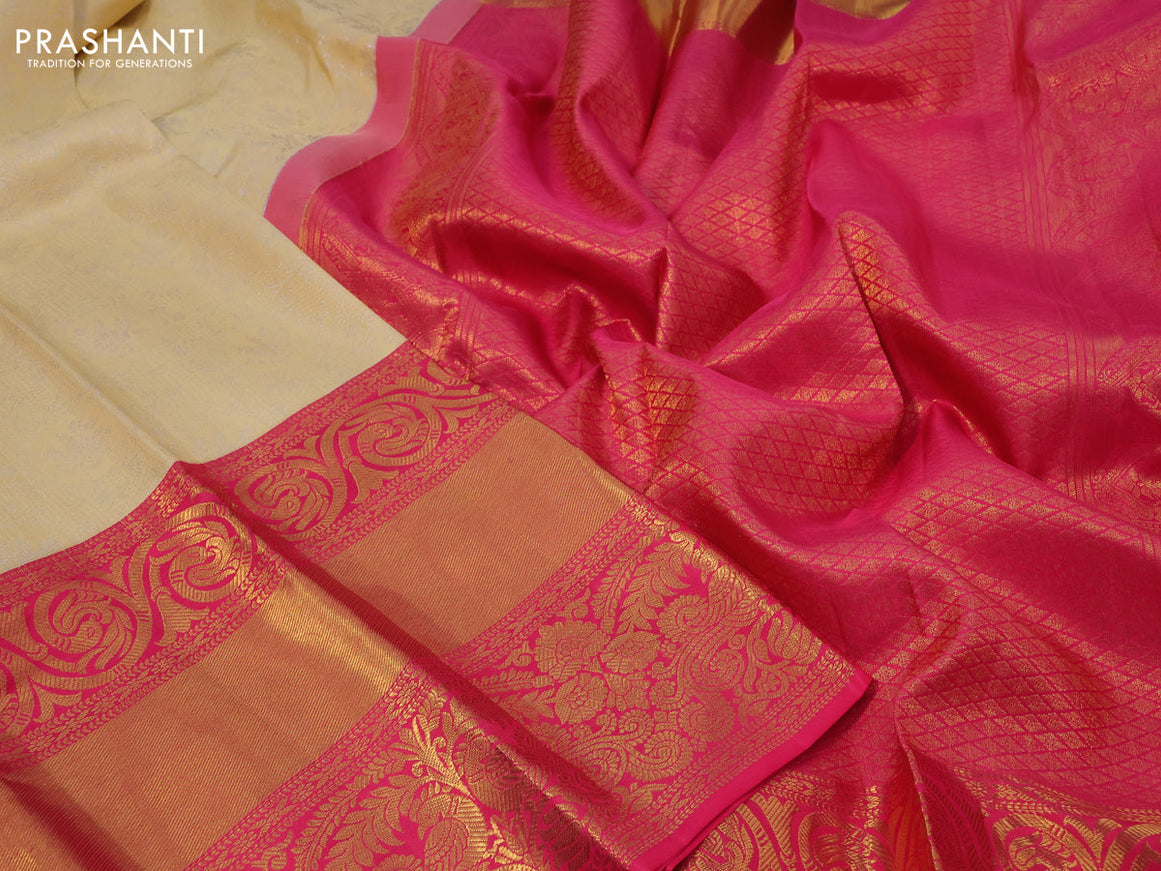 Pure kanchipuram silk saree sandal and pink with allover silver zari woven brocade weaves and long zari woven border