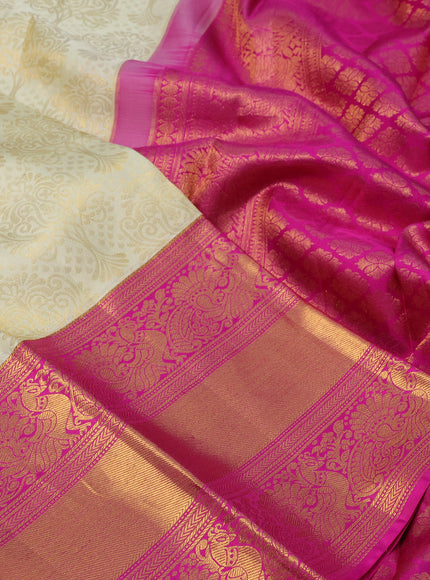 Pure kanchipuram silk saree cream and pink with allover zari woven brocade weaves and long zari woven annam border