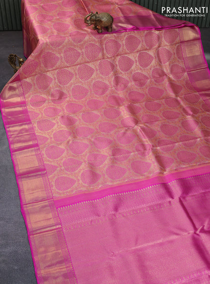 Pure kanchipuram tissue silk saree peach shade and pink with allover zari woven brocade weaves and zari woven border