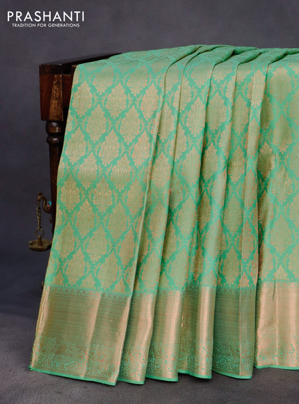 Pure kanchipuram silk saree pastel green with allover copper zari woven brocade weaves and zari woven border