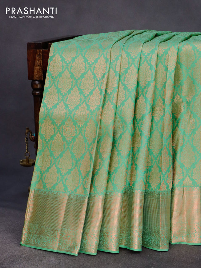 Pure kanchipuram silk saree pastel green with allover copper zari woven brocade weaves and zari woven border