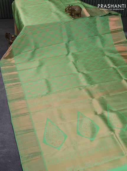 Pure kanchipuram silk saree pastel green with allover copper zari woven brocade weaves and zari woven border