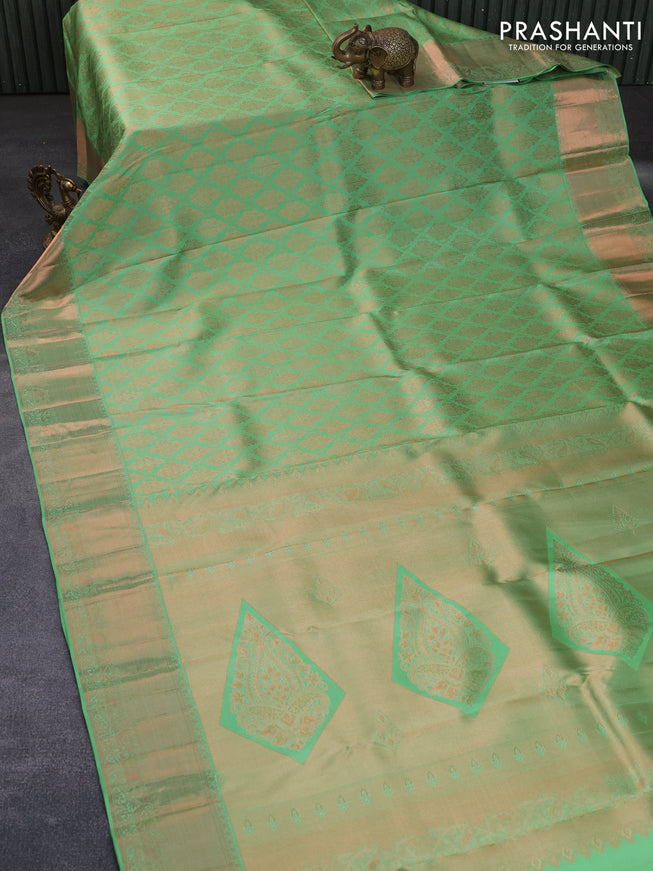 Pure kanchipuram silk saree pastel green with allover copper zari woven brocade weaves and zari woven border