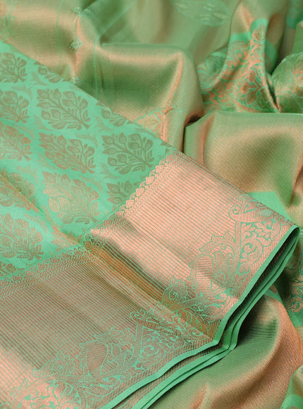 Pure kanchipuram silk saree pastel green with allover copper zari woven brocade weaves and zari woven border