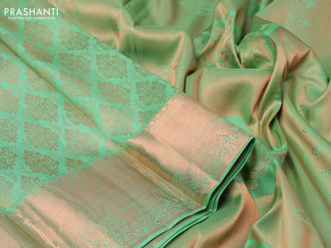 Pure kanchipuram silk saree pastel green with allover copper zari woven brocade weaves and zari woven border