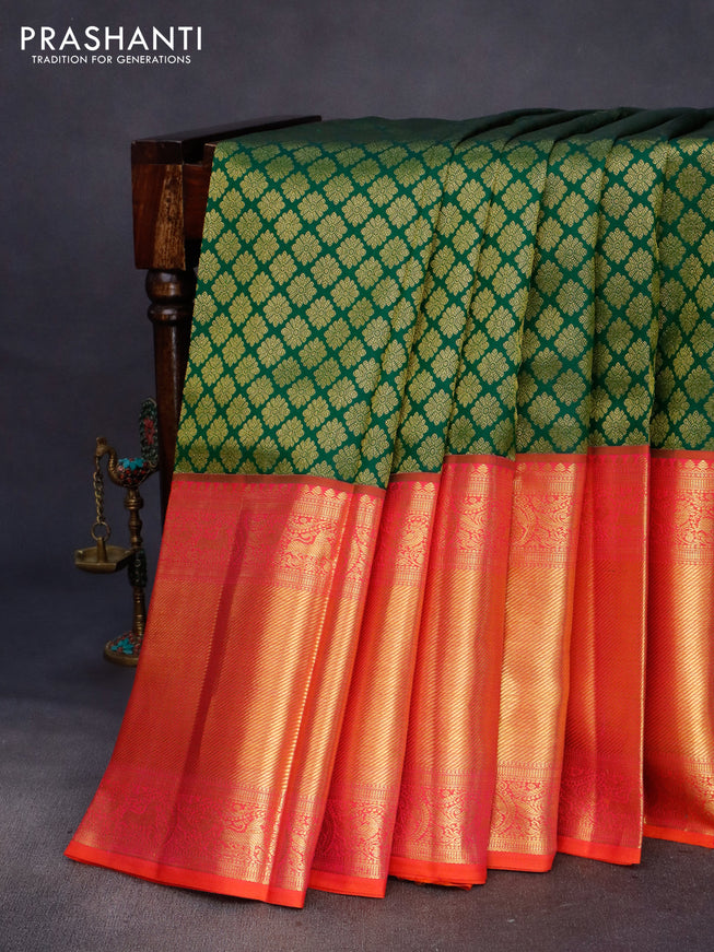 Pure kanchipuram silk saree green and dual shade of pinkish orange with allover zari woven butta weaves and long zari woven border