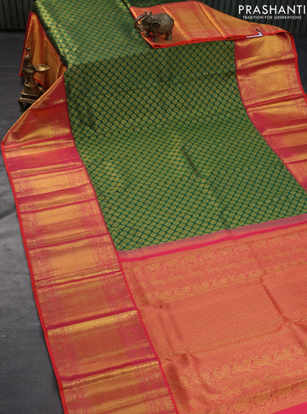 Pure kanchipuram silk saree green and dual shade of pinkish orange with allover zari woven butta weaves and long zari woven border