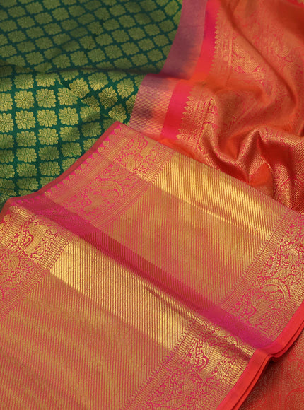 Pure kanchipuram silk saree green and dual shade of pinkish orange with allover zari woven butta weaves and long zari woven border