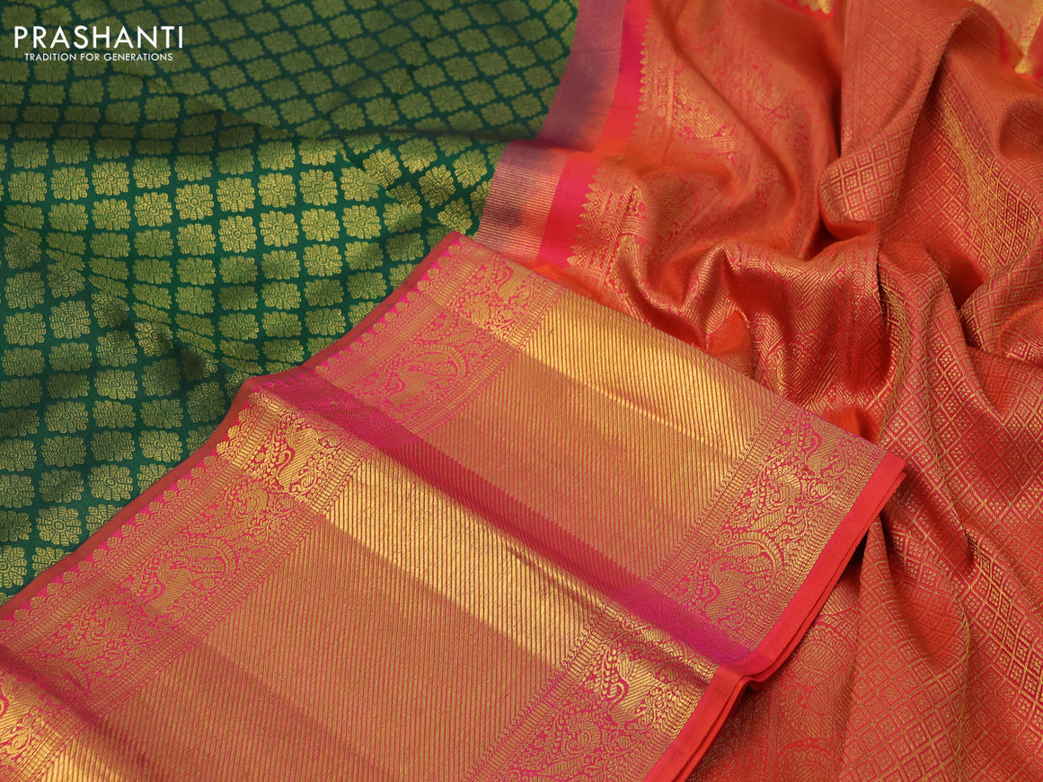 Pure kanchipuram silk saree green and dual shade of pinkish orange with allover zari woven butta weaves and long zari woven border