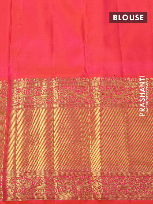 Pure kanchipuram silk saree green and dual shade of pinkish orange with allover zari woven butta weaves and long zari woven border