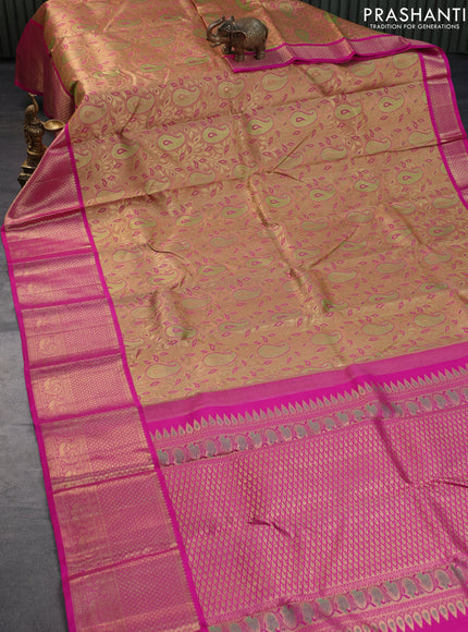 Pure kanchipuram tissue silk saree peach shade and pink with allover zari woven brocade weaves and long zari woven border