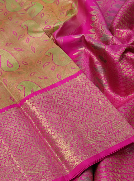 Pure kanchipuram tissue silk saree peach shade and pink with allover zari woven brocade weaves and long zari woven border