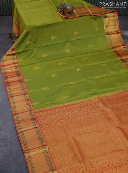 Pure kanchipuram silk saree light green and orange with paisley zari woven buttas and zari woven korvai border