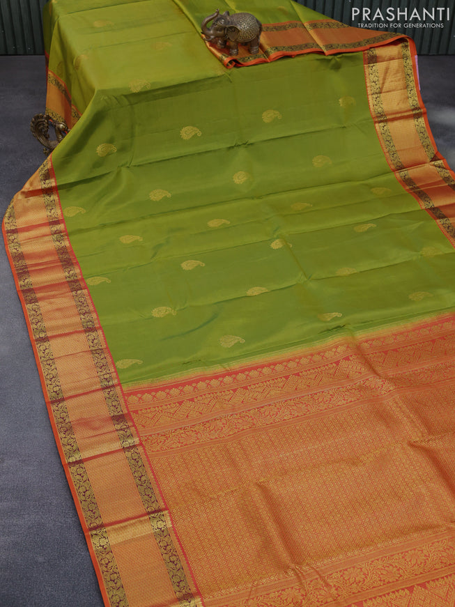 Pure kanchipuram silk saree light green and orange with paisley zari woven buttas and zari woven korvai border