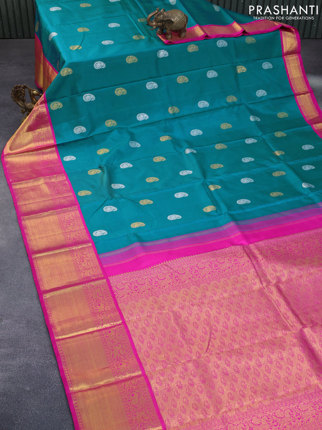 Pure kanchipuram silk saree teal blue and pink with paisley zari woven buttas and zari woven korvai border