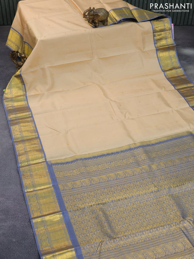 Pure kanchipuram silk saree sandal and grey with zari woven buttas and zari woven korvai border