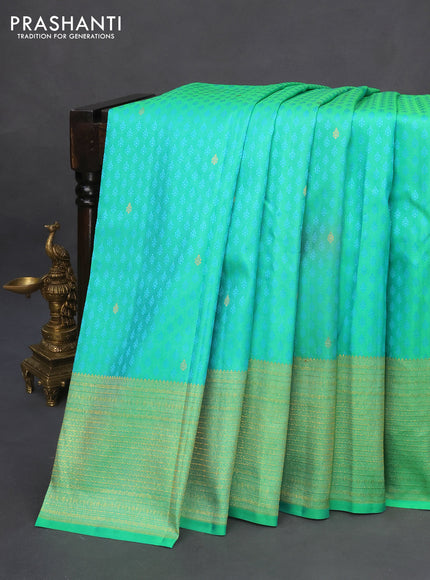 Pure kanchipuram silk saree dual shade of teal green with allover self emboss & zari buttas and zari woven border