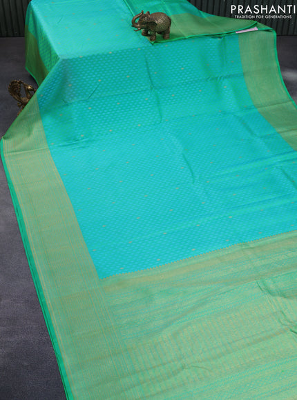 Pure kanchipuram silk saree dual shade of teal green with allover self emboss & zari buttas and zari woven border