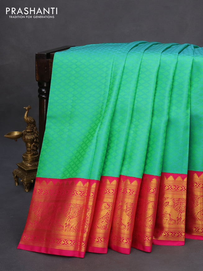 Pure kanchipuram silk saree dual shade of teal green and pink with allover self emboss and zari woven korvai border