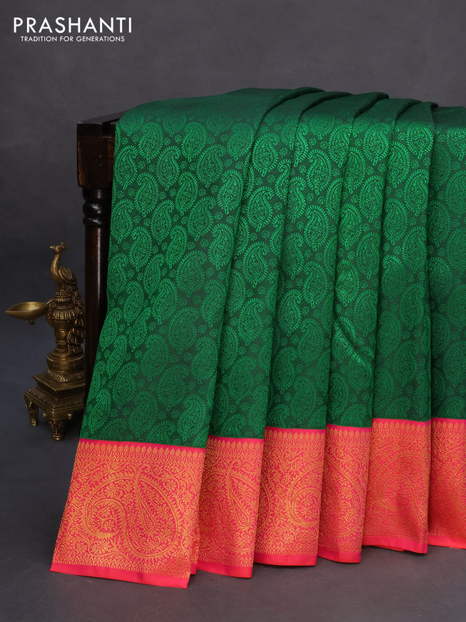 Pure kanchipuram silk saree green and dual shade of pinkish orange with allover self emboss and zari woven border