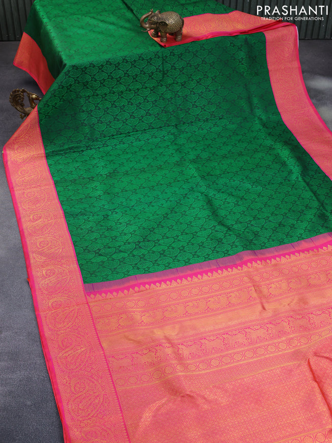 Pure kanchipuram silk saree green and dual shade of pinkish orange with allover self emboss and zari woven border