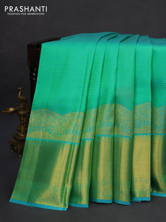 Pure kanchipuram silk saree dual shade of teal green and teal blue with allover self emboss and long zari woven border