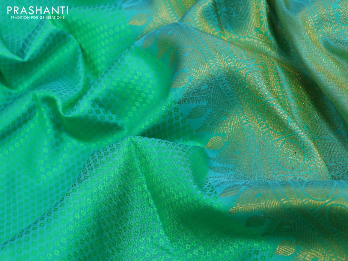 Pure kanchipuram silk saree dual shade of teal green and teal blue with allover self emboss and long zari woven border