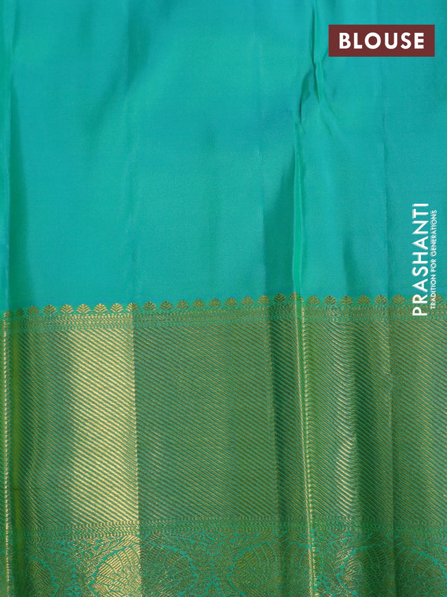 Pure kanchipuram silk saree dual shade of teal green and teal blue with allover self emboss and long zari woven border