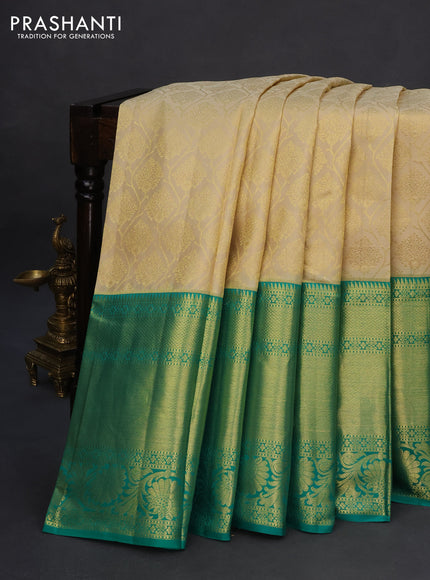 Pure kanchipuram silk saree cream and teal green with allover zari woven brocade weaves and zari woven floral border