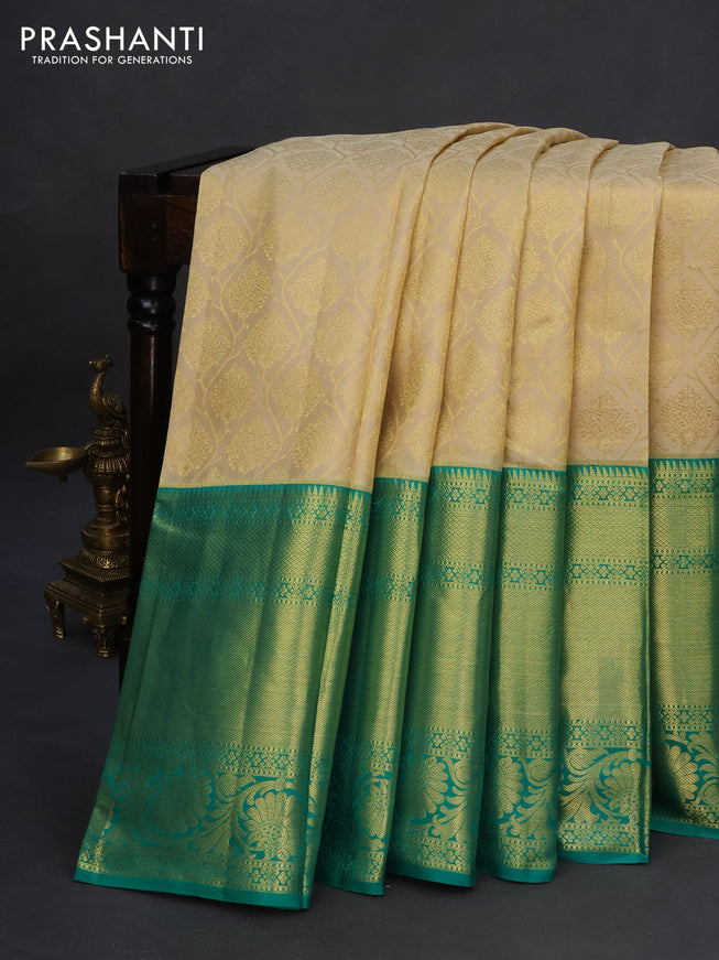 Pure kanchipuram silk saree cream and teal green with allover zari woven brocade weaves and zari woven floral border