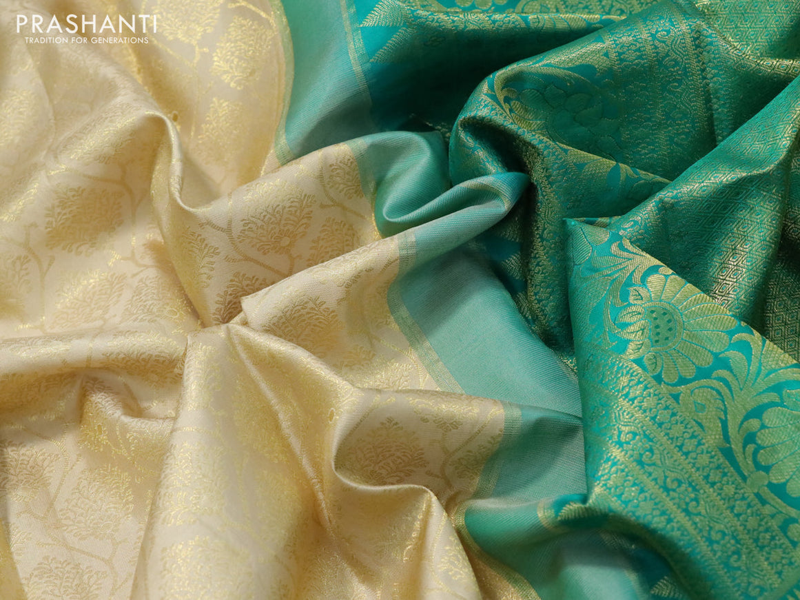 Pure kanchipuram silk saree cream and teal green with allover zari woven brocade weaves and zari woven floral border