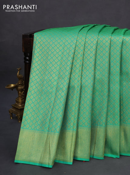 Pure kanchipuram silk saree teal green with allover zari woven brocade weaves and zari woven border