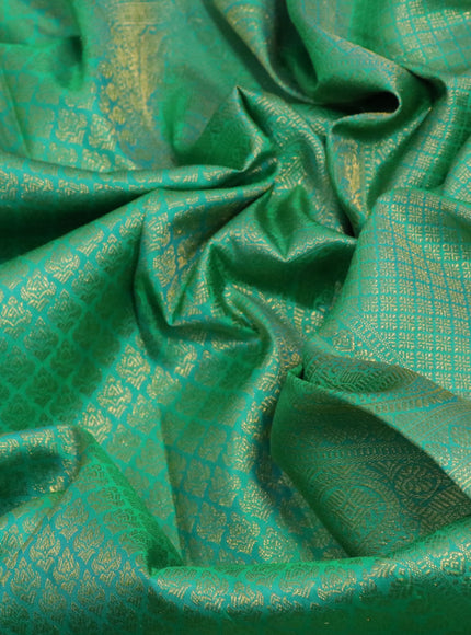 Pure kanchipuram silk saree teal green with allover zari woven brocade weaves and zari woven border