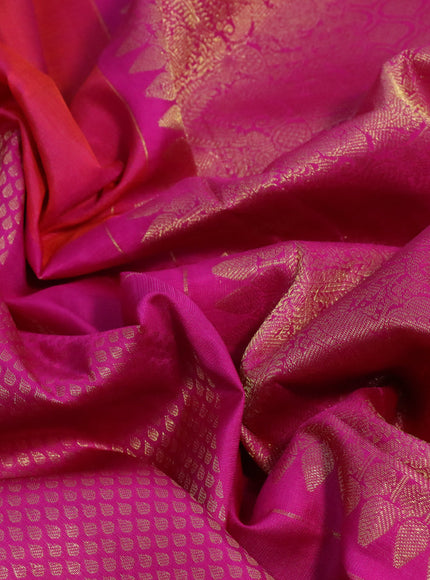 Pure kanchipuram silk saree dual shade of pinkish orange and pink with half & half style and long zari woven border